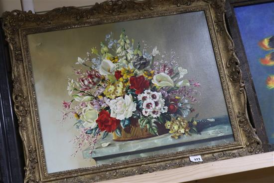 G Rock, oil on canvas, Still life of flowers in a basket on a ledge, signed and dated 50, 51 x 66cm.